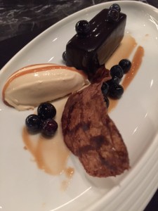 Chocolate Bar with salted caramel ice cream with caramel sauce and blueberries 